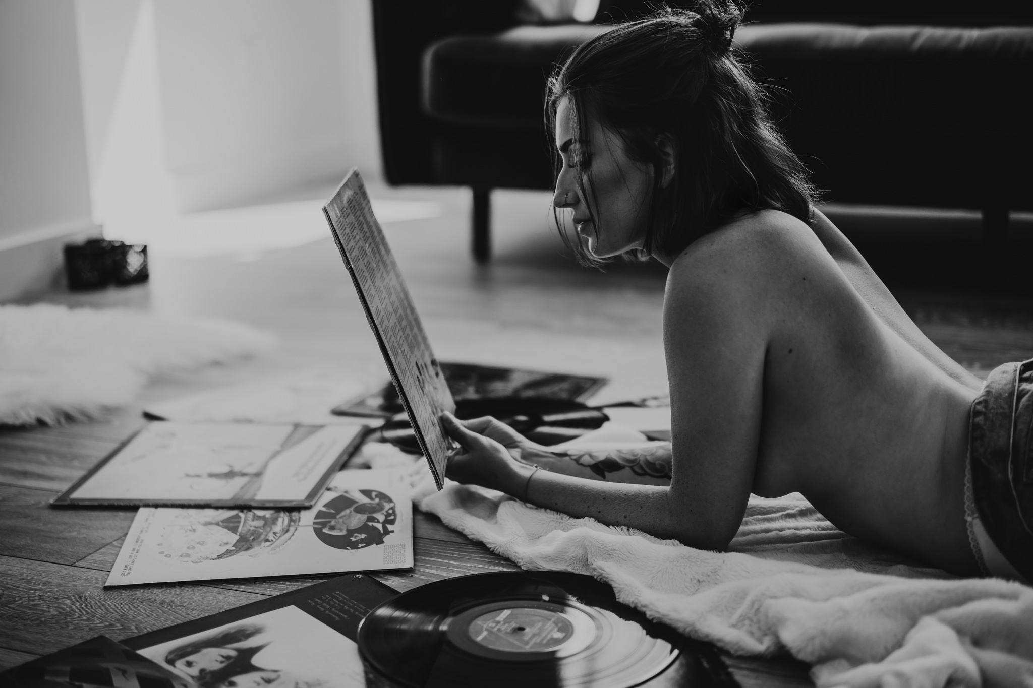 A woman poses for a boudoir photos with Emily Schutz Photography in Edmonton, Alberta, Canada.